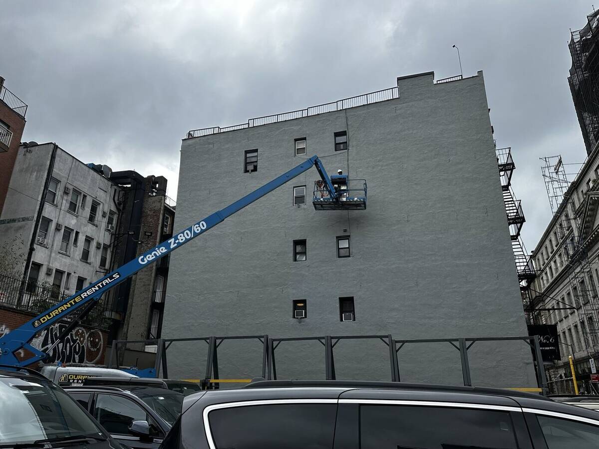 Boom lift positioned for a close-up facade inspection