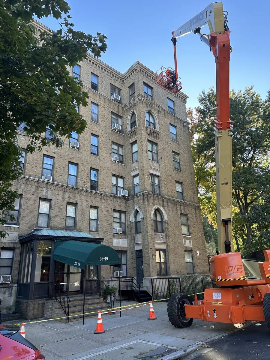 Boom lift positioned for a close-up facade inspection