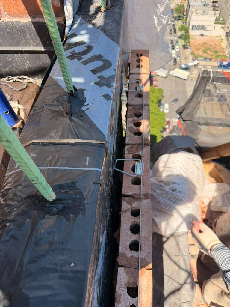 Flashing and waterproofing detail at a roof edge
