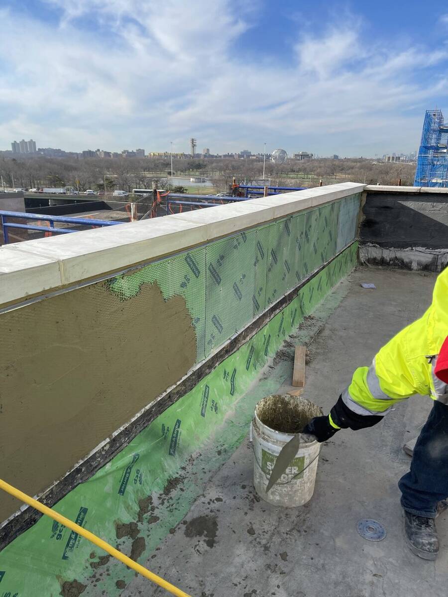 Building envelope waterproofing work on a roof