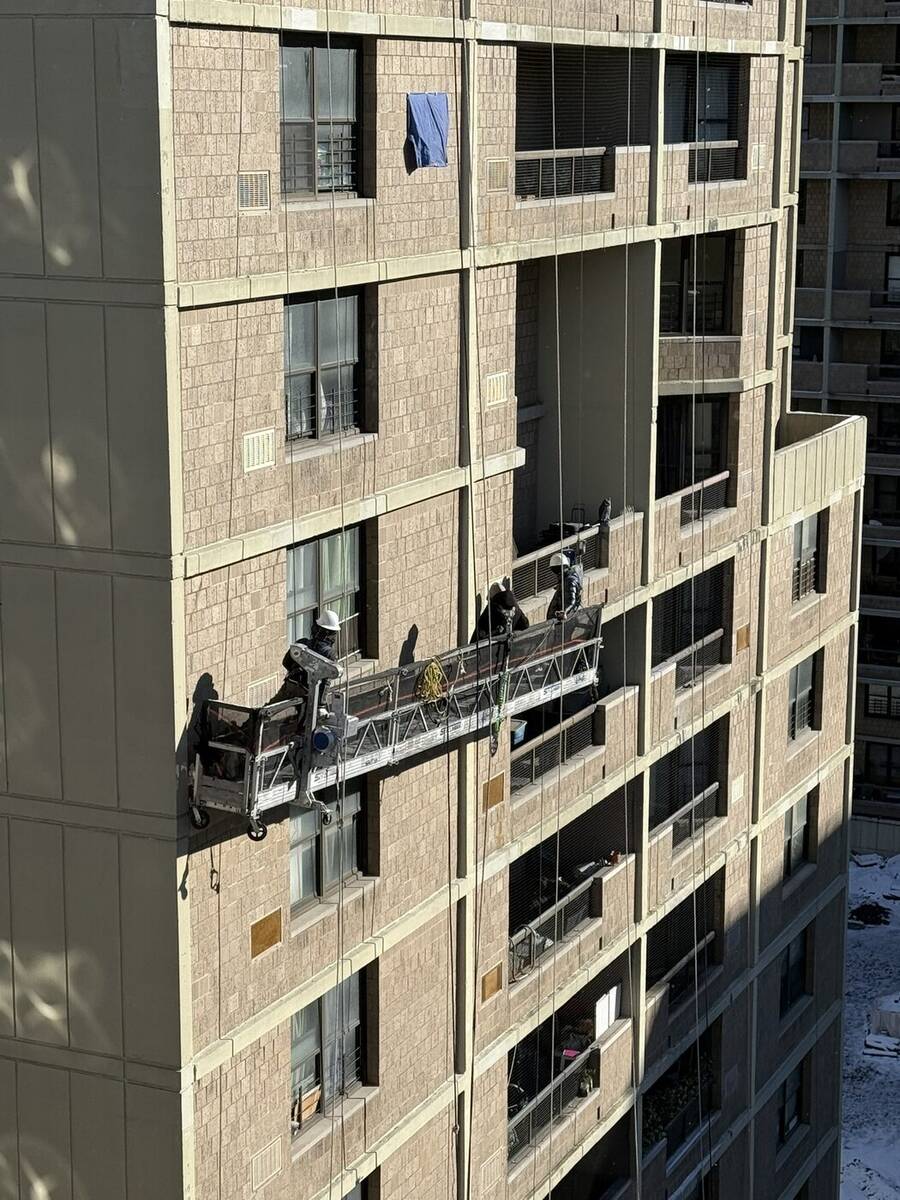 Structural scaffold decking supporting a sidewalk shed